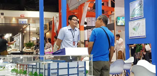 PEB Steel’s sale representative introduces to a visitor about the pre-engineered steel buildings.